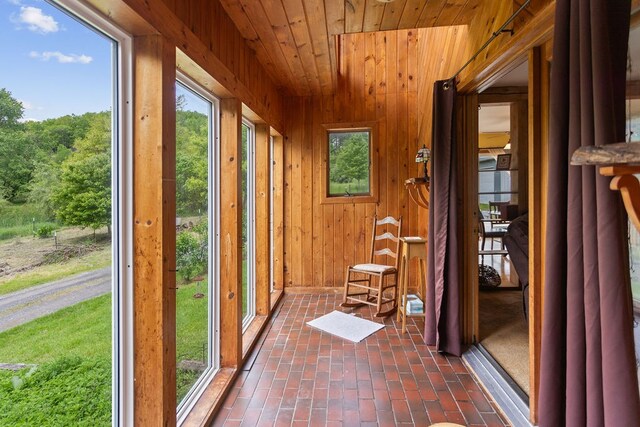 315 Old Tioga St, Wellsboro, PA 16901 - entryway featuring wooden ceiling, wood walls, and brick flooring