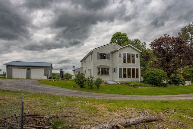 315 Old Tioga St, Wellsboro, PA 16901 - view of front of property with an outdoor structure, a front yard, and a garage