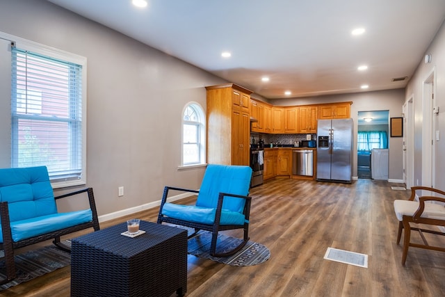 interior space with a healthy amount of sunlight and dark hardwood / wood-style floors