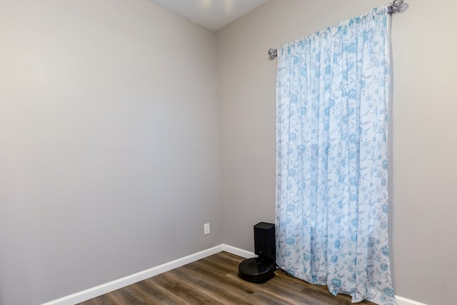 empty room featuring dark wood-type flooring