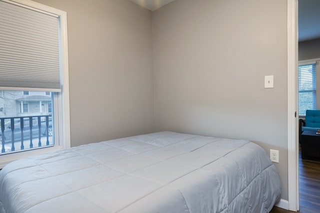 bedroom with wood-type flooring