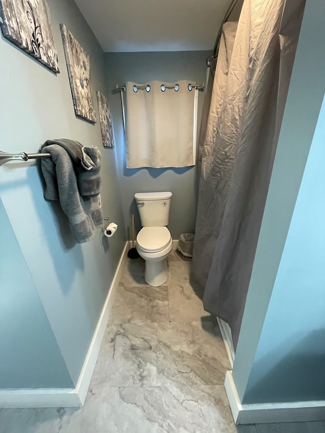 bathroom featuring toilet