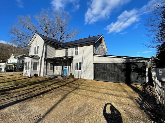 view of side of home featuring a garage