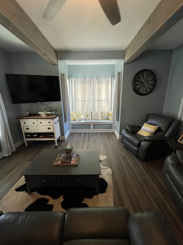 living room with beamed ceiling and dark hardwood / wood-style floors