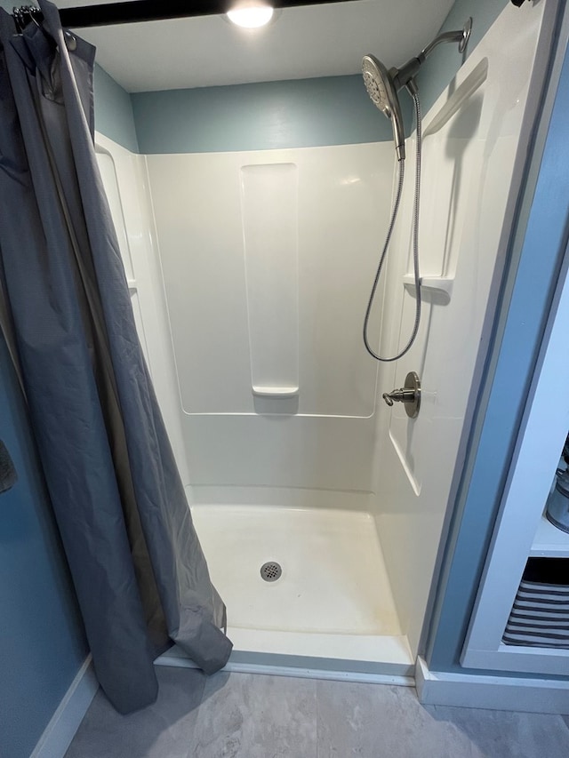 bathroom featuring a shower with curtain