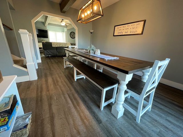 dining room featuring beamed ceiling, ceiling fan, and dark wood-type flooring