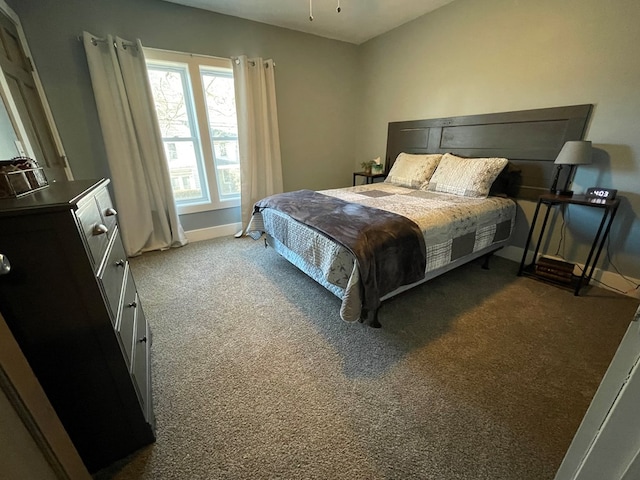 bedroom featuring dark carpet