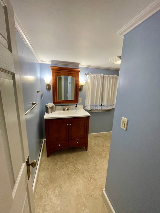 bathroom featuring vanity and ornamental molding