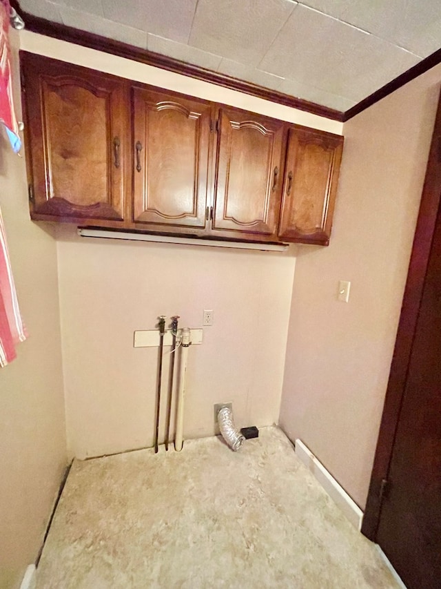 washroom with cabinets and hookup for a washing machine