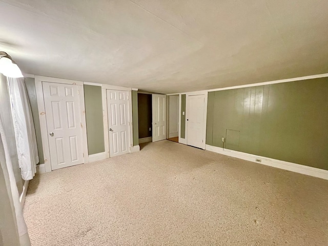 unfurnished bedroom featuring carpet