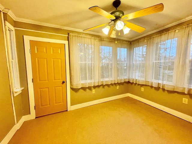 unfurnished sunroom with ceiling fan