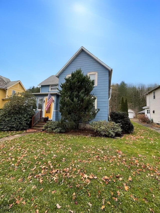 view of front of property with a front lawn