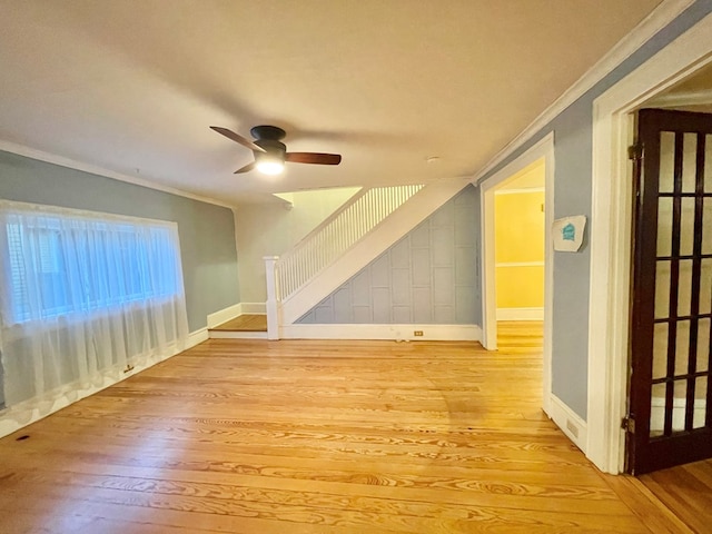 additional living space with ceiling fan and light hardwood / wood-style flooring