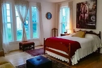 bedroom with wood-type flooring