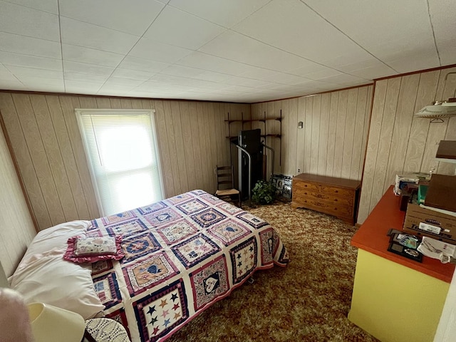 421 State St, Towanda, PA 18848 - bedroom with wooden walls and carpet floors