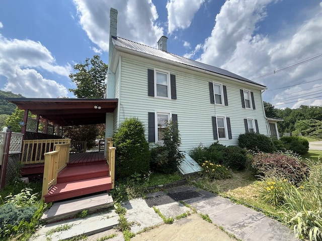421 State St, Towanda, PA 18848 - view of front of property with a chimney and a metal roof