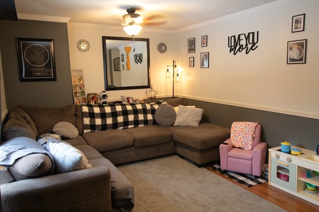 living room featuring hardwood / wood-style flooring, ceiling fan, crown molding, and a textured ceiling