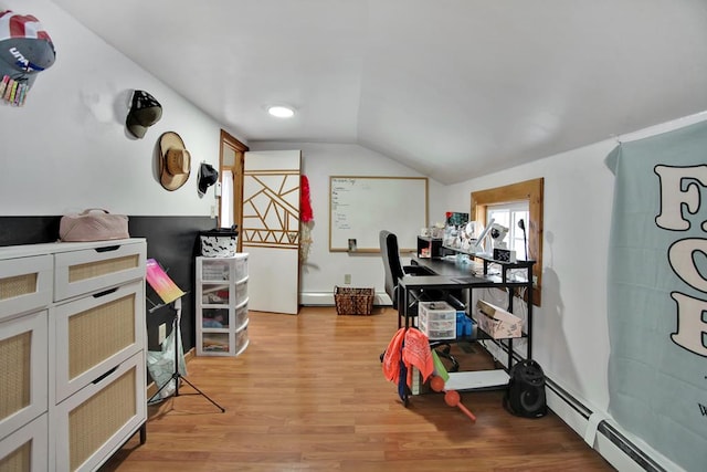 interior space with light hardwood / wood-style floors, vaulted ceiling, and a baseboard radiator