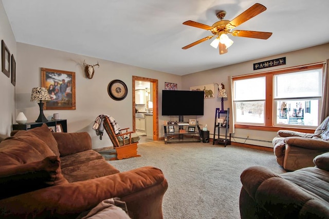 living room with baseboard heating, ceiling fan, and carpet floors