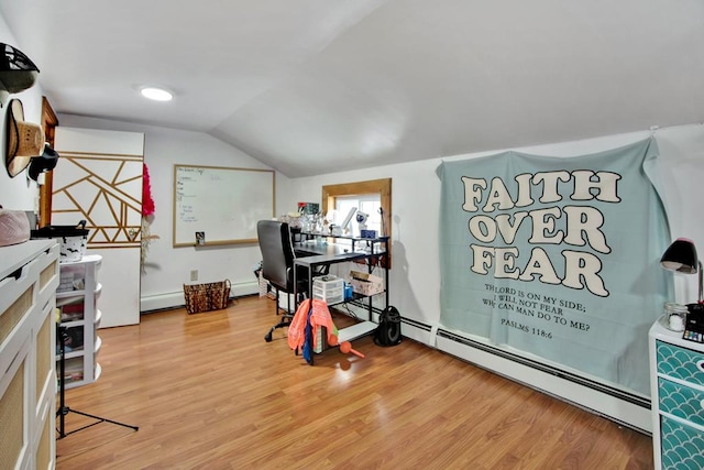 home office featuring hardwood / wood-style floors, lofted ceiling, and a baseboard radiator