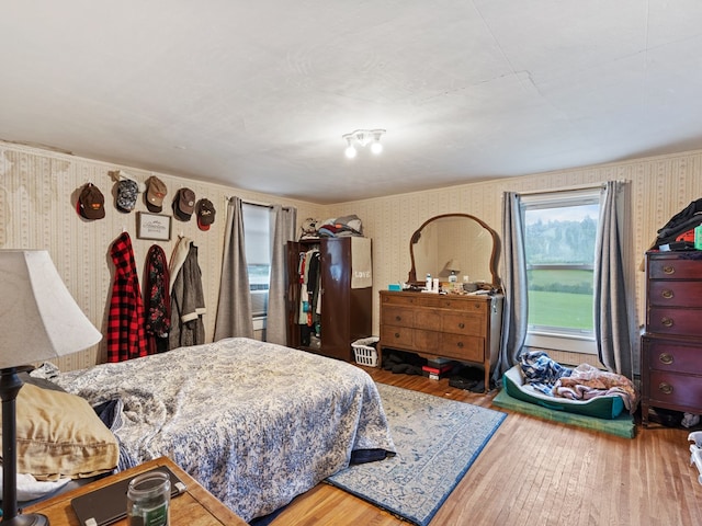 bedroom with hardwood / wood-style floors