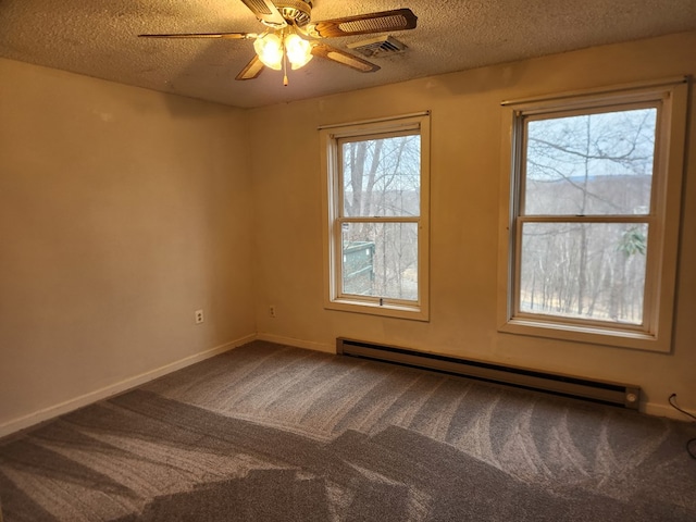 empty room featuring a baseboard radiator, visible vents, carpet flooring, a textured ceiling, and baseboards