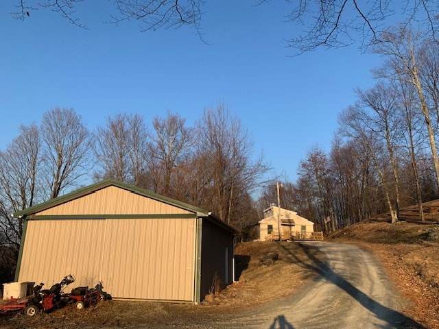 exterior space featuring dirt driveway