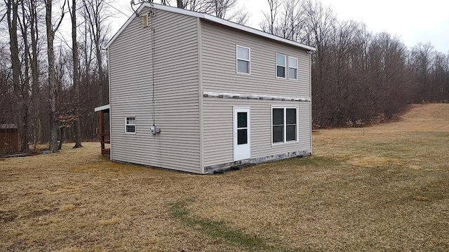 view of side of property featuring a yard