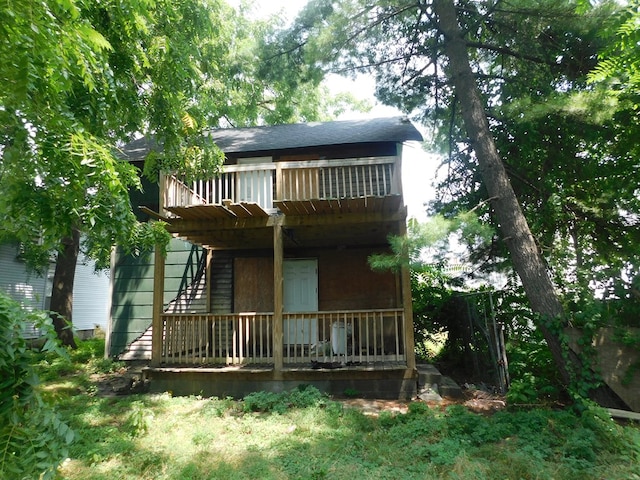 rear view of property with a balcony