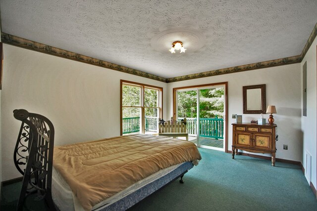 carpeted bedroom featuring access to outside and a textured ceiling