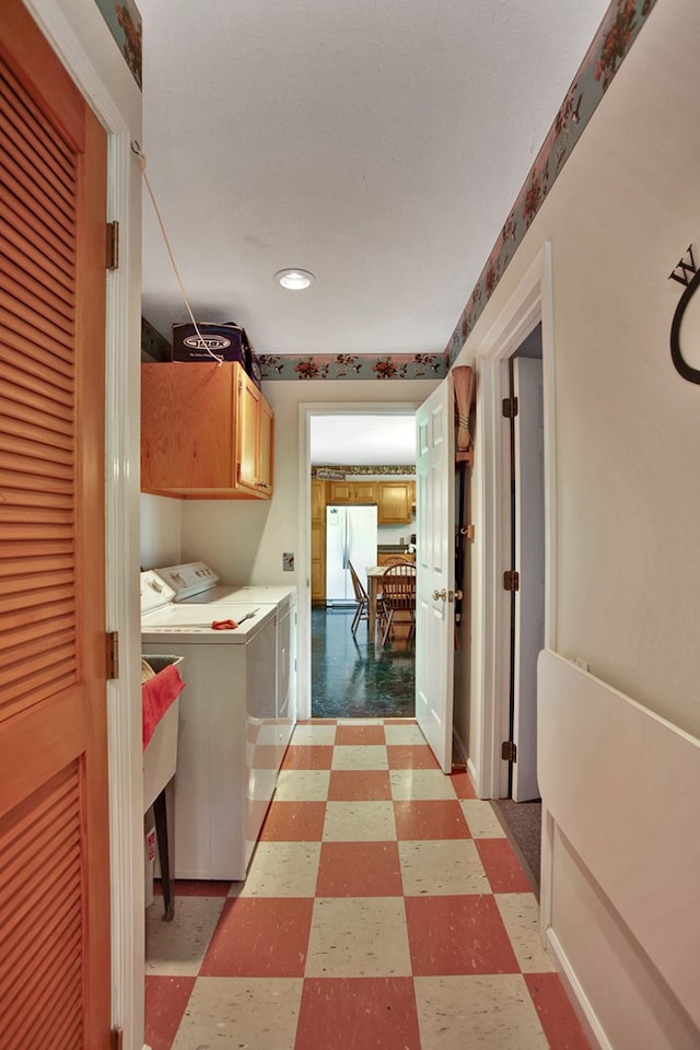 laundry area featuring cabinets and washer and dryer