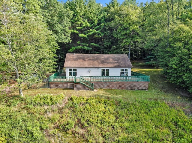 exterior space with a lawn and a deck