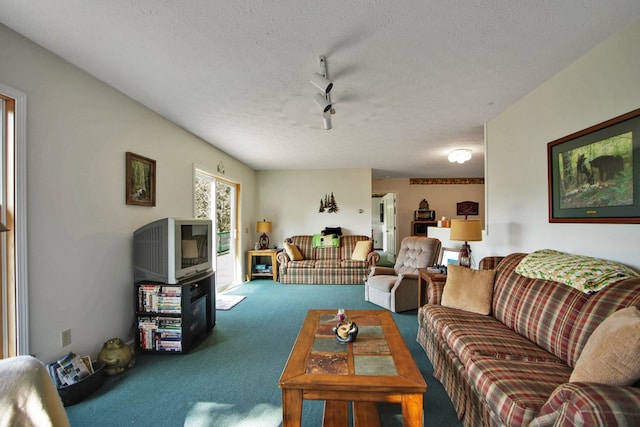 living room with carpet, a textured ceiling, and ceiling fan