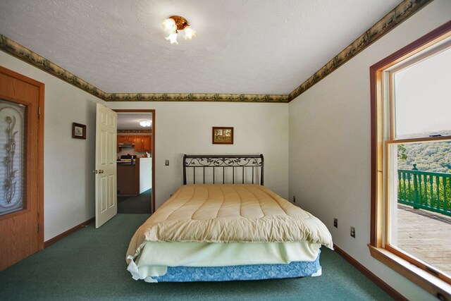 carpeted bedroom with a textured ceiling