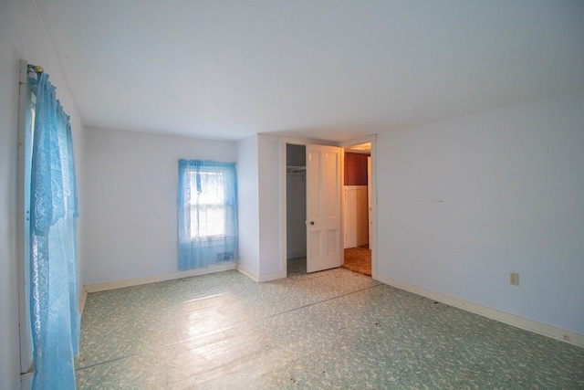 unfurnished bedroom featuring a closet