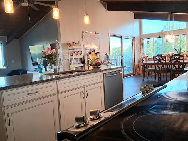 47 Alpine Dr, Athens, PA 18810 - kitchen featuring stainless steel dishwasher, ceiling fan, beam ceiling, white cabinetry, and high vaulted ceiling