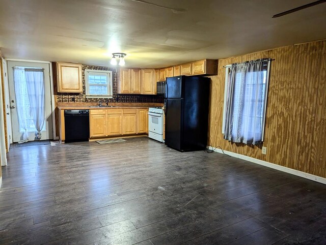 kitchen featuring light brown cabinetry, dark hardwood / wood-style flooring, sink, and black appliances