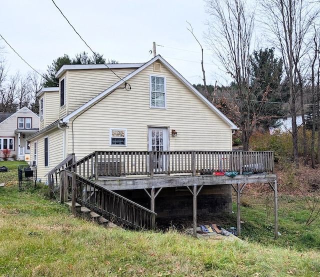 back of house with a wooden deck