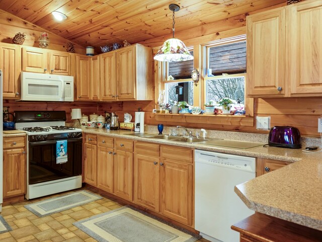 102-108 Fred Catlin Rd, Owego, NY 13827 - kitchen with light countertops, vaulted ceiling, a sink, white appliances, and decorative light fixtures