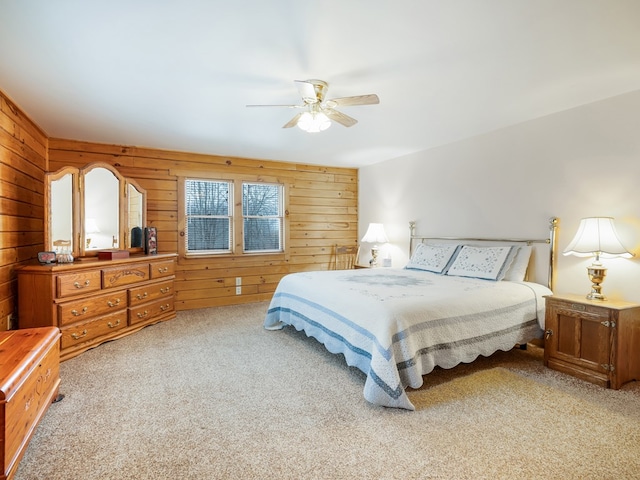 102-108 Fred Catlin Rd, Owego, NY 13827 - bedroom featuring light colored carpet, a ceiling fan, and wooden walls