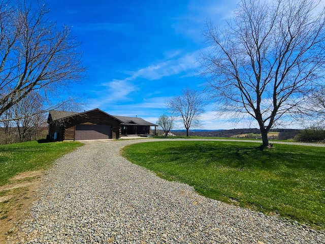 102-108 Fred Catlin Rd, Owego, NY 13827 - view of front facade with an attached garage, gravel driveway, and a front yard