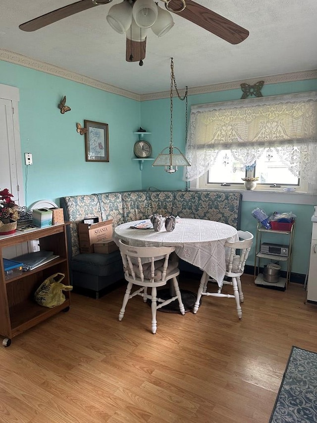 dining space with hardwood / wood-style flooring and breakfast area