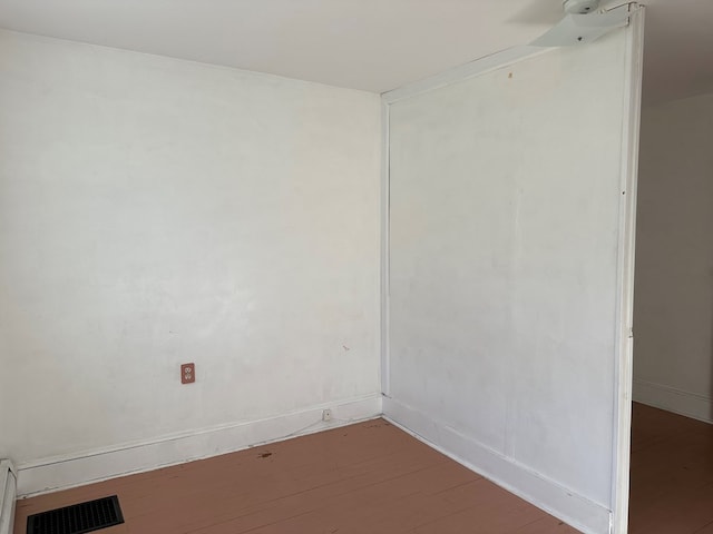 unfurnished room featuring hardwood / wood-style flooring