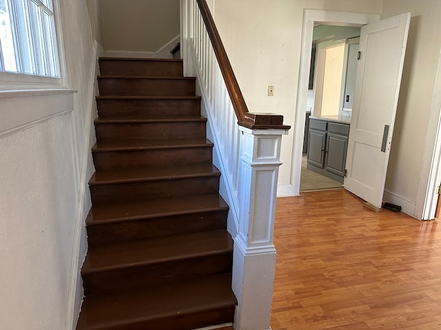 stairway featuring wood-type flooring