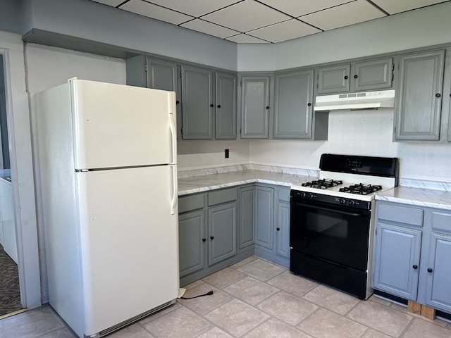 kitchen featuring white appliances and gray cabinetry