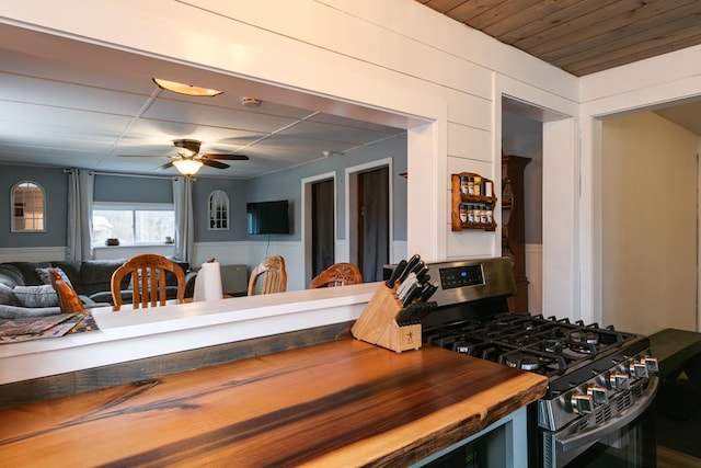 77 Pine Creek Village Rd, Gaines, PA 16921 - kitchen with wood counters, stainless steel gas range oven, and ceiling fan
