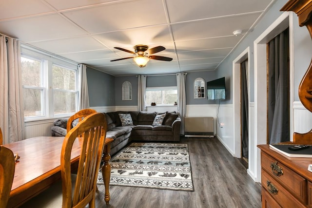 77 Pine Creek Village Rd, Gaines, PA 16921 - living room with dark wood-style flooring, a ceiling fan, and a wainscoted wall