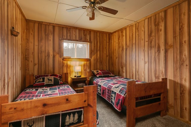 77 Pine Creek Village Rd, Gaines, PA 16921 - carpeted bedroom featuring wood walls and a ceiling fan