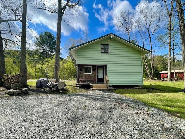 77 Pine Creek Village Rd, Gaines, PA 16921 - rear view of property featuring a fire pit and entry steps