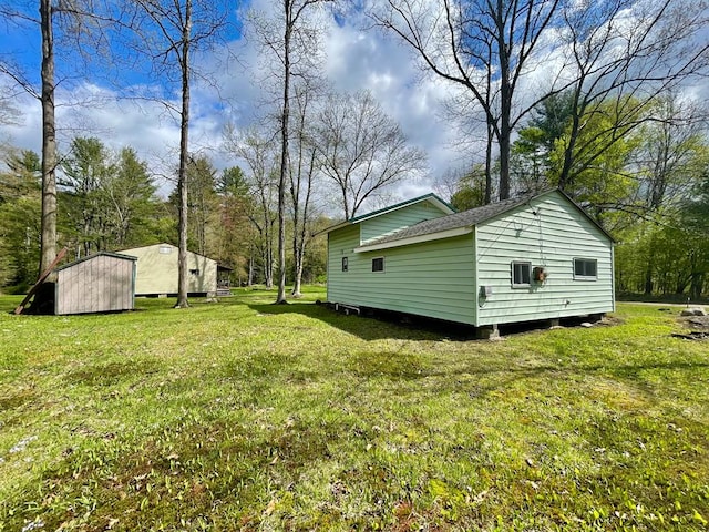 77 Pine Creek Village Rd, Gaines, PA 16921 - view of yard with a storage unit and an outbuilding